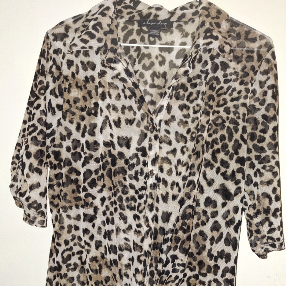 Leopard print, ties in front.. dress up blouse, or wear with jeans!
